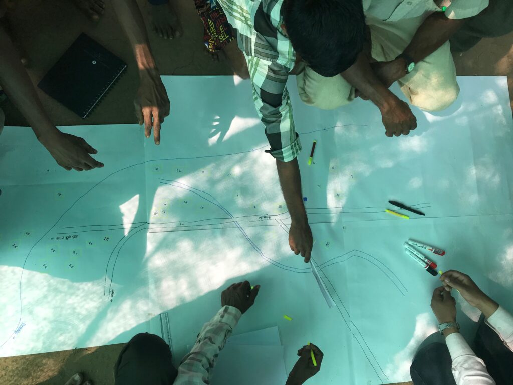 People working together to build resilience through our concept - Foundations, Flows and Fortitude. Making plans and creating table-top excercises. People involved. People at the center.